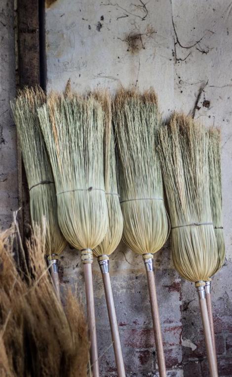 Brooms on wall